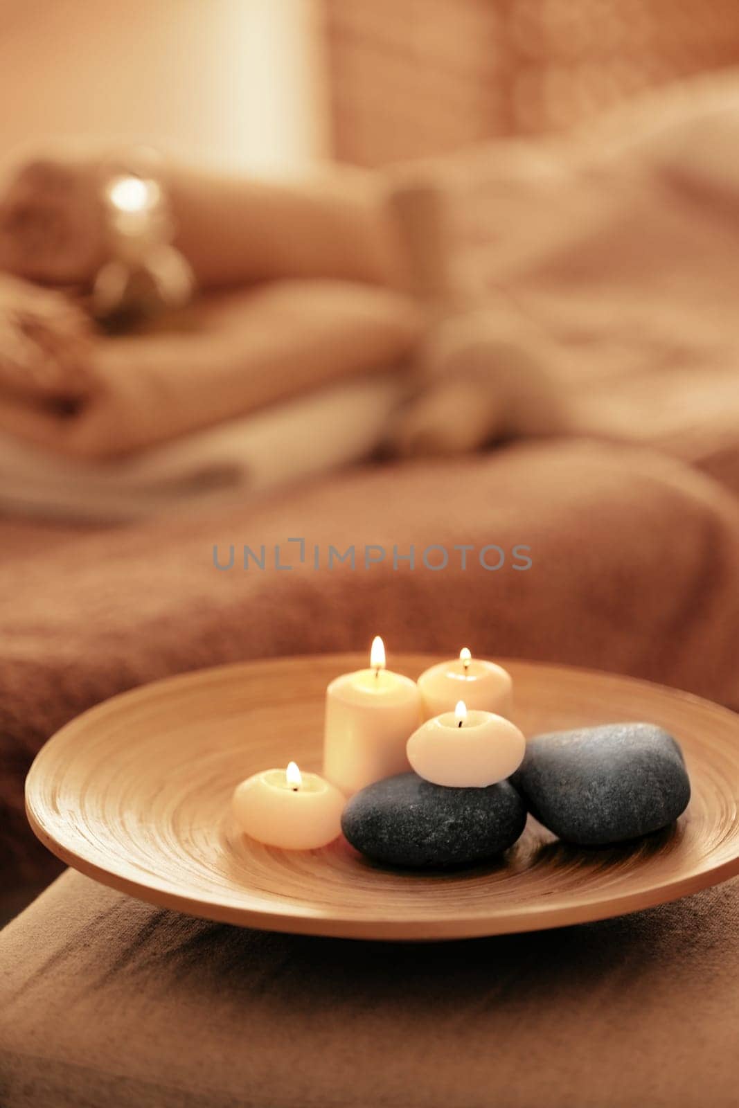 Spa set with candles and stones on tray