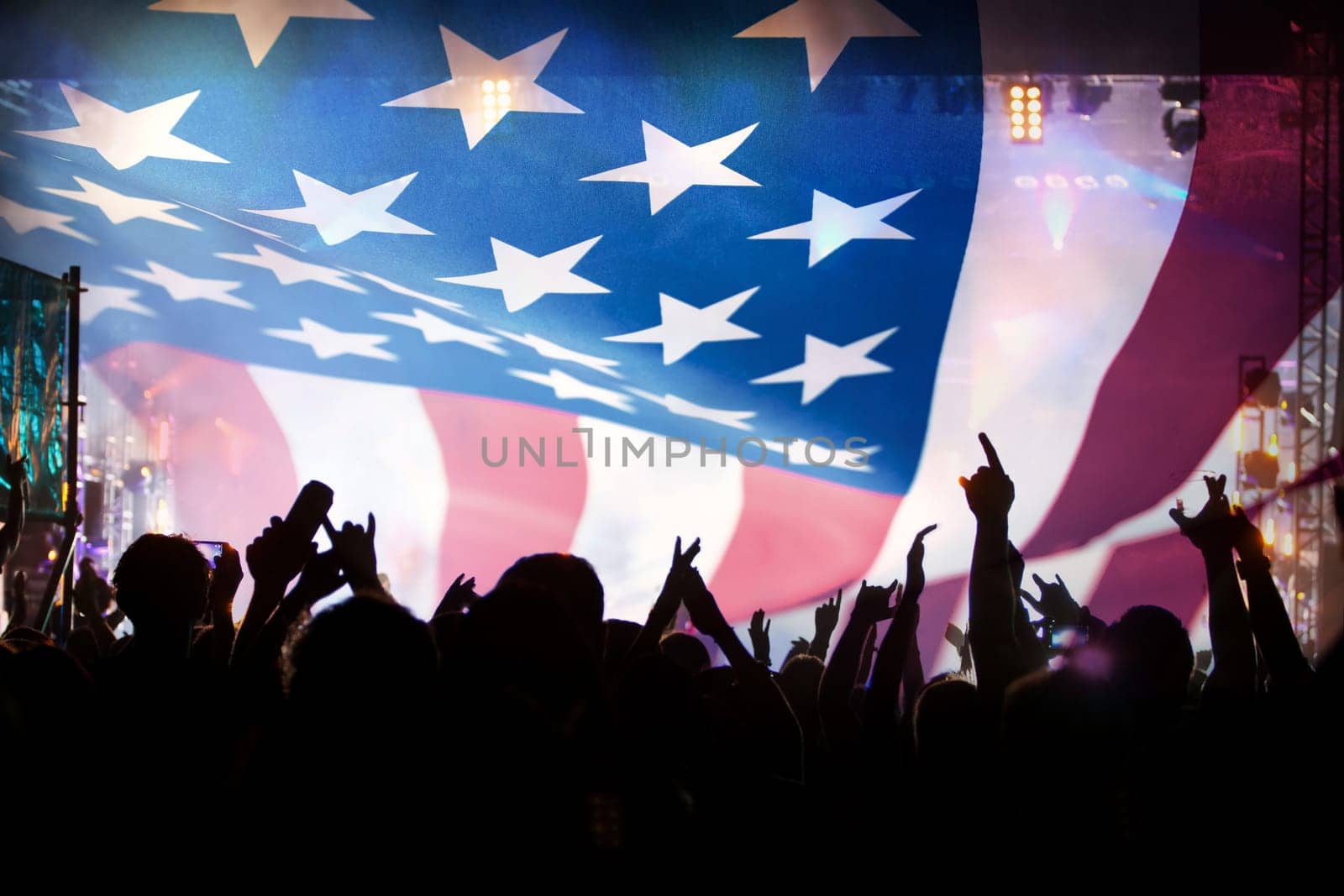 Crowd of people celebrating Independence Day. United States of America USA flag with fireworks background for 4th of July.