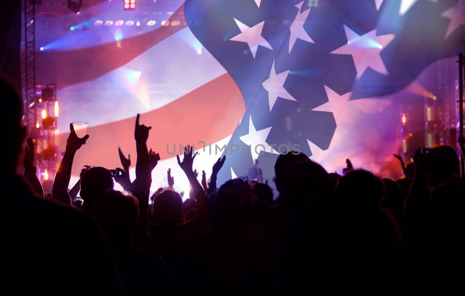 Crowd of people celebrating Independence Day. United States of America USA flag with fireworks background for 4th of July.