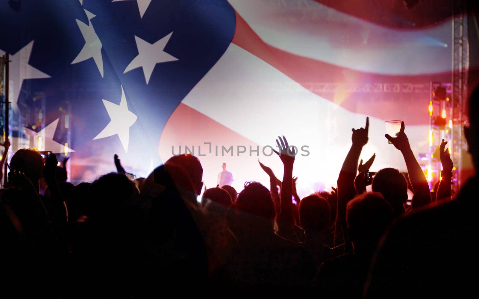 Crowd of people celebrating Independence Day. United States of America USA flag with fireworks background for 4th of July.