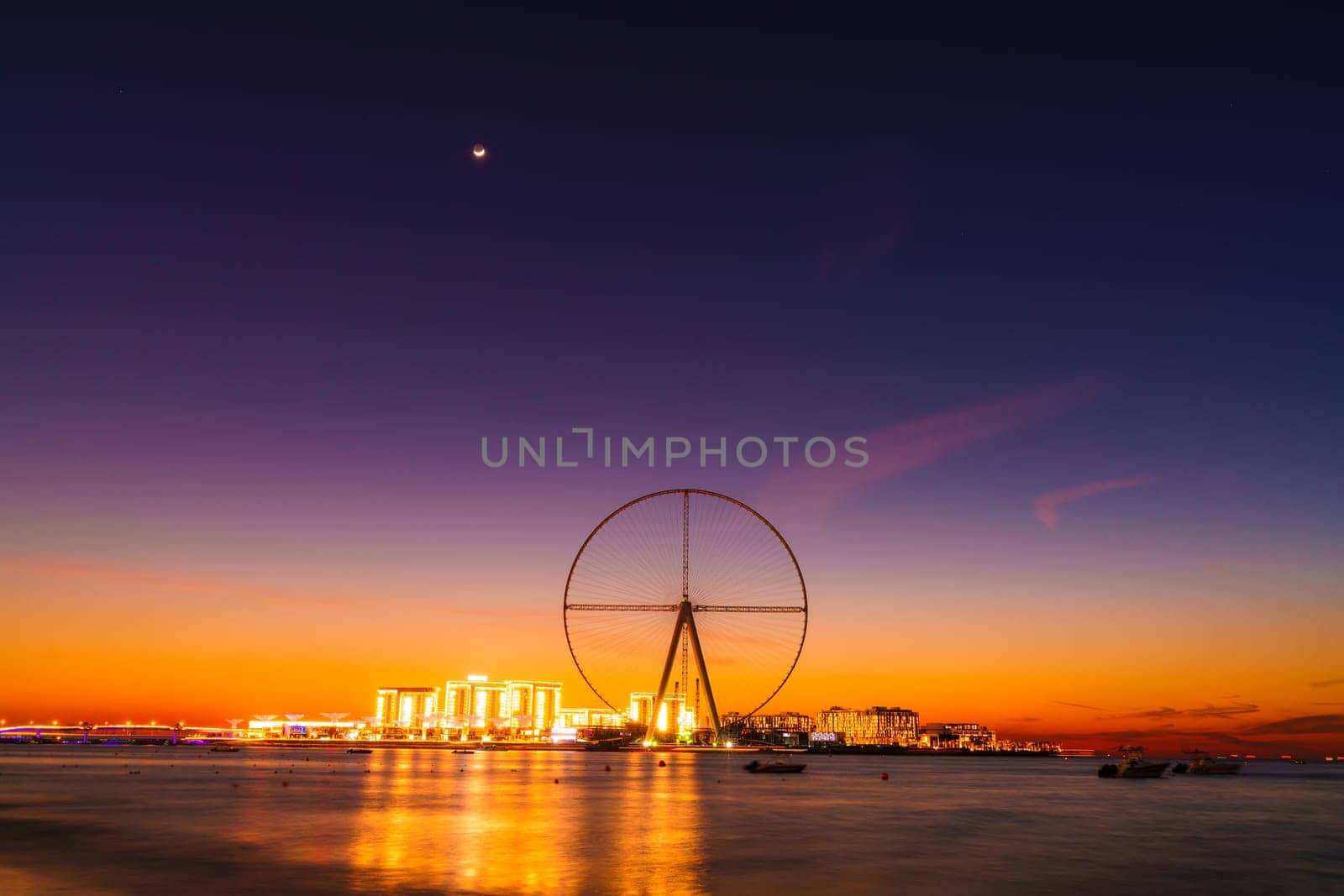 Twilight view of Bluewaters Island and Ain Dubai during construction, Dubai, UAE