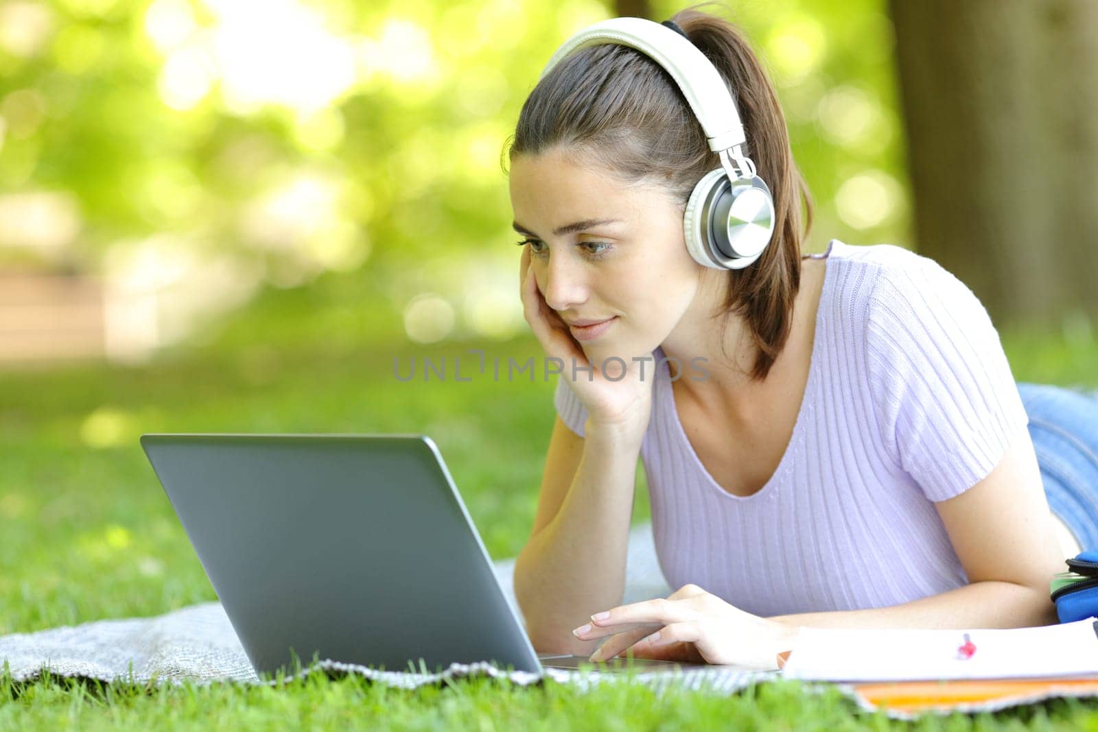 Student e-learning using laptop and headphones