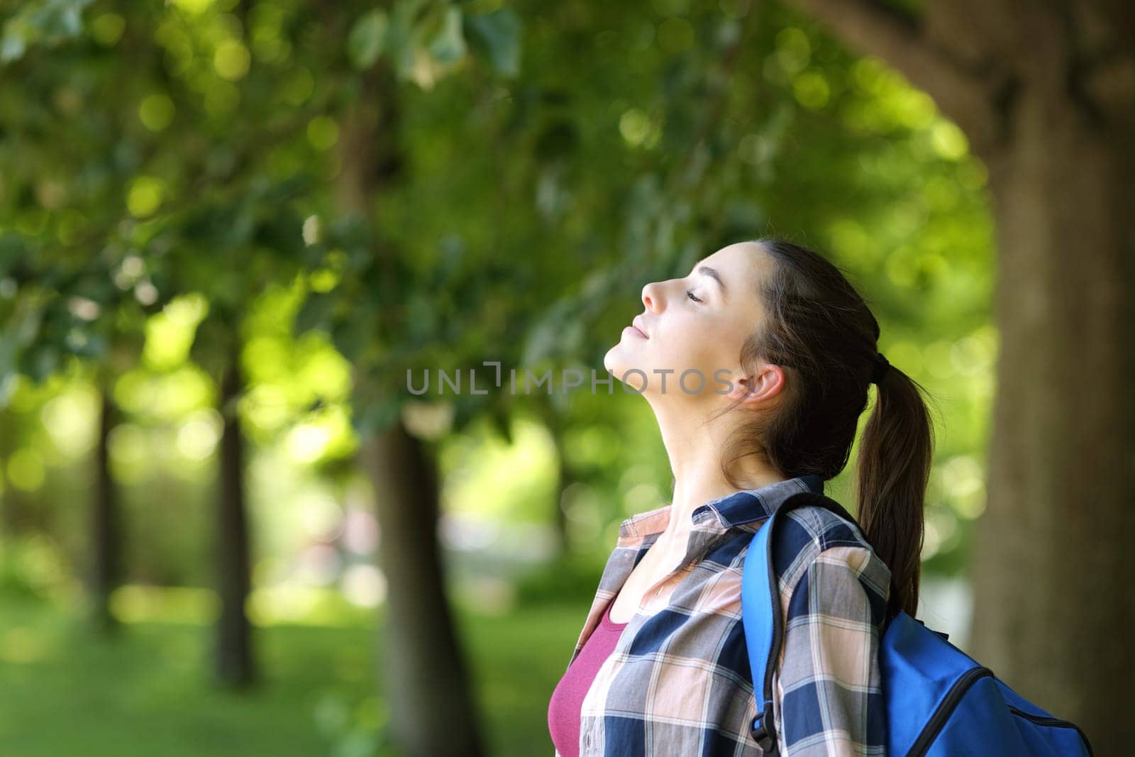 Student breathing fresh air in a campus or park