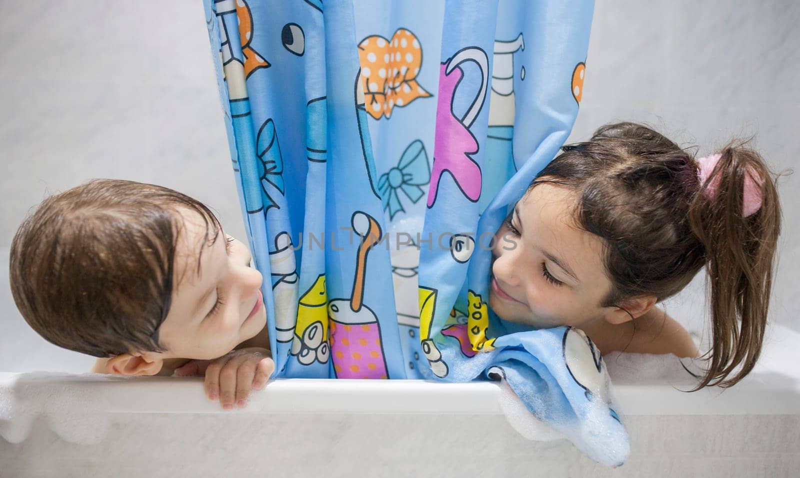 Children enjoy bathing. Leisure time bathtub time for children concept