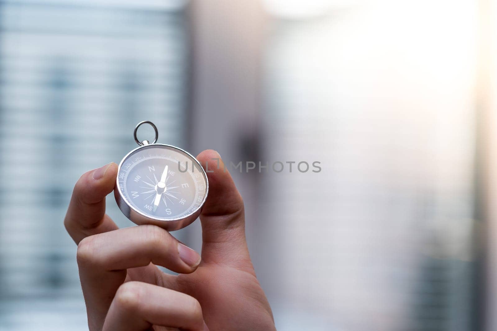 Young freelancer with compass holding in hand, cutout
