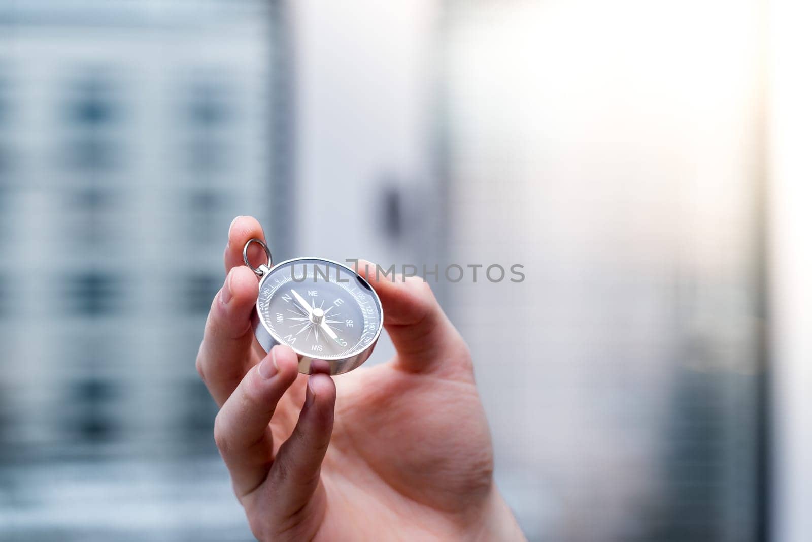 Young freelancer with compass holding in hand, cutout