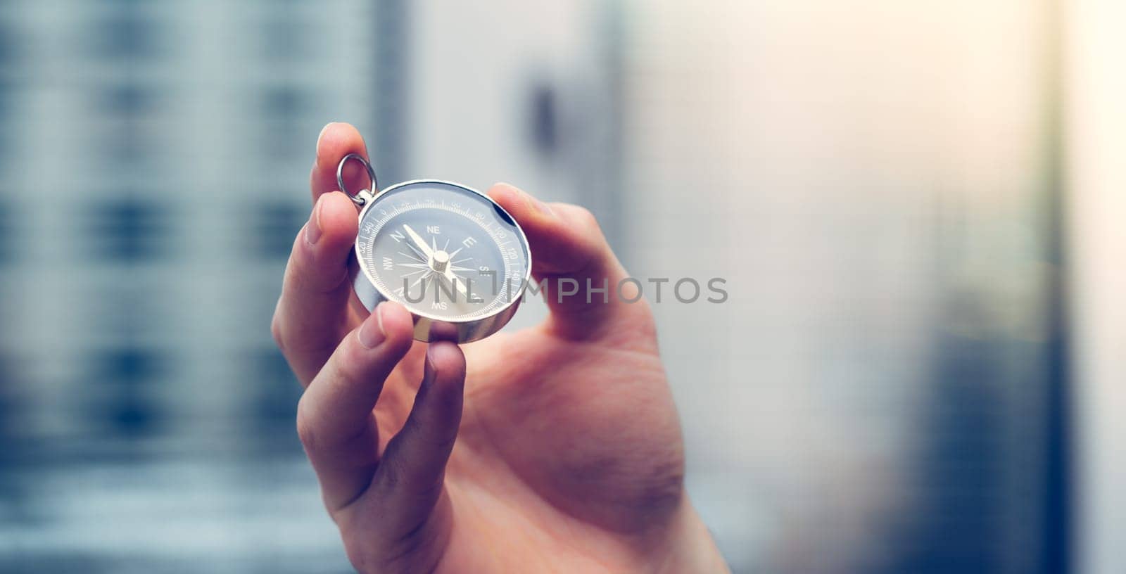 Young freelancer with compass holding in hand, cutout