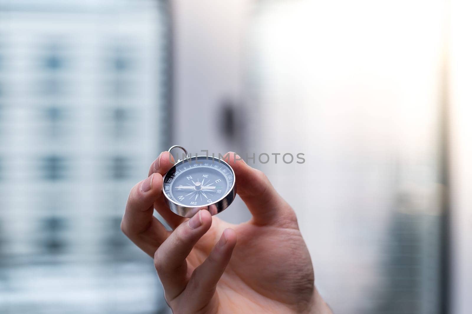 Young freelancer with compass holding in hand, cutout