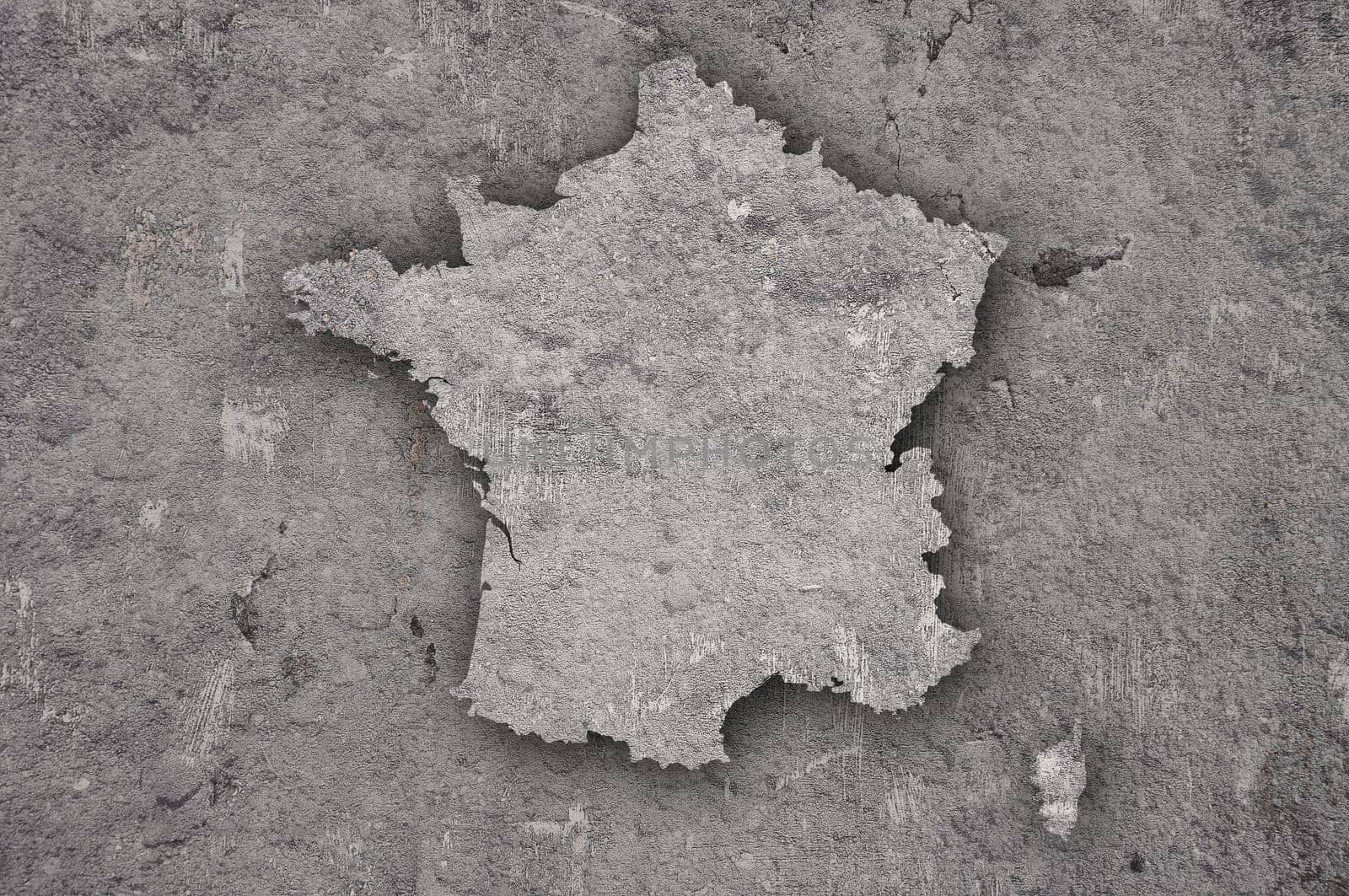 Map of France on weathered concrete