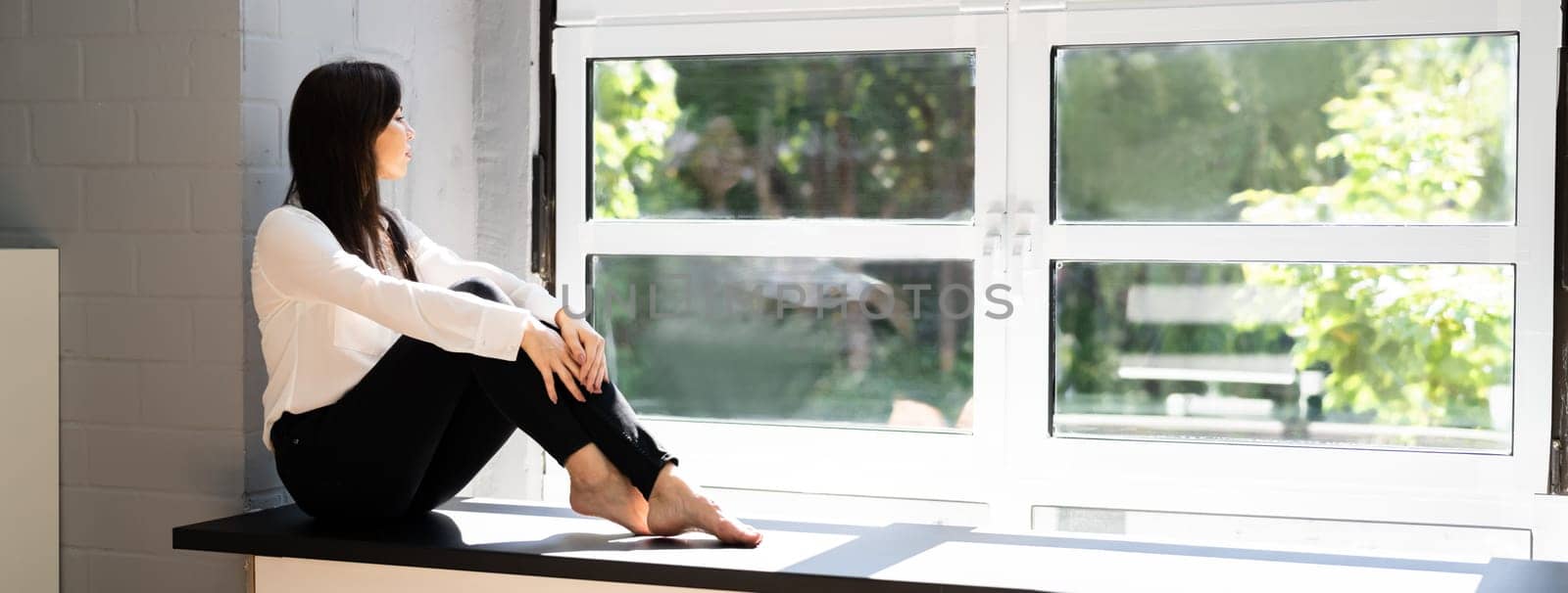 Beautiful Female Girl Resting Near Window. Young People Lifestyle