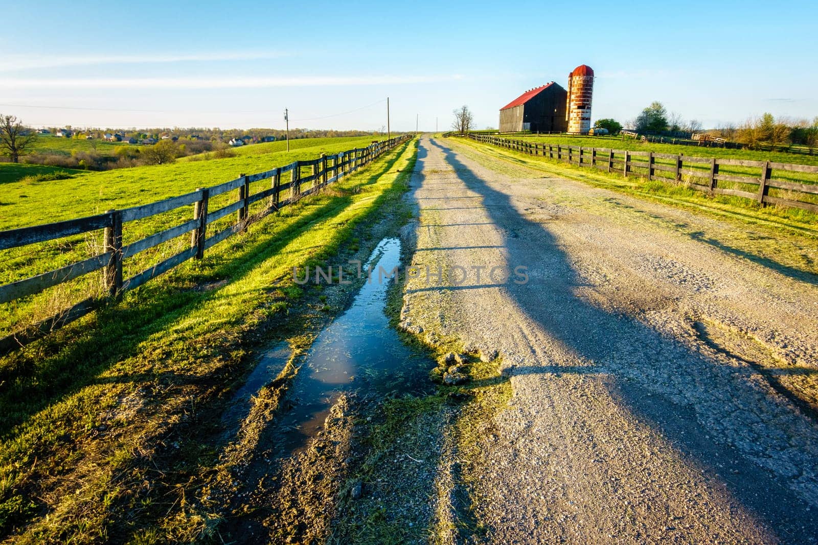 Poorly maintained country road through a farm in Central Kentucky