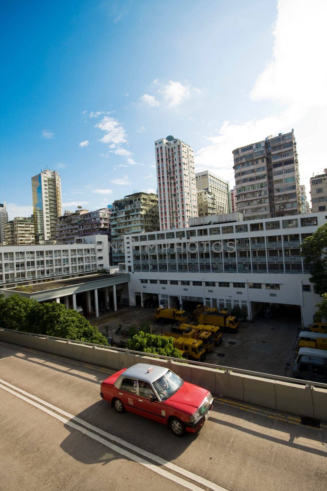 taxi passing the road in city at day