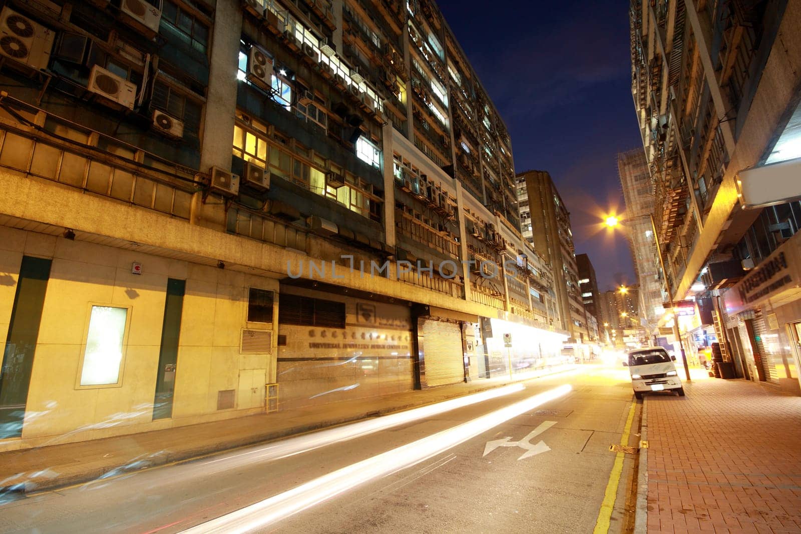 traffic at night in hong kong old building zone