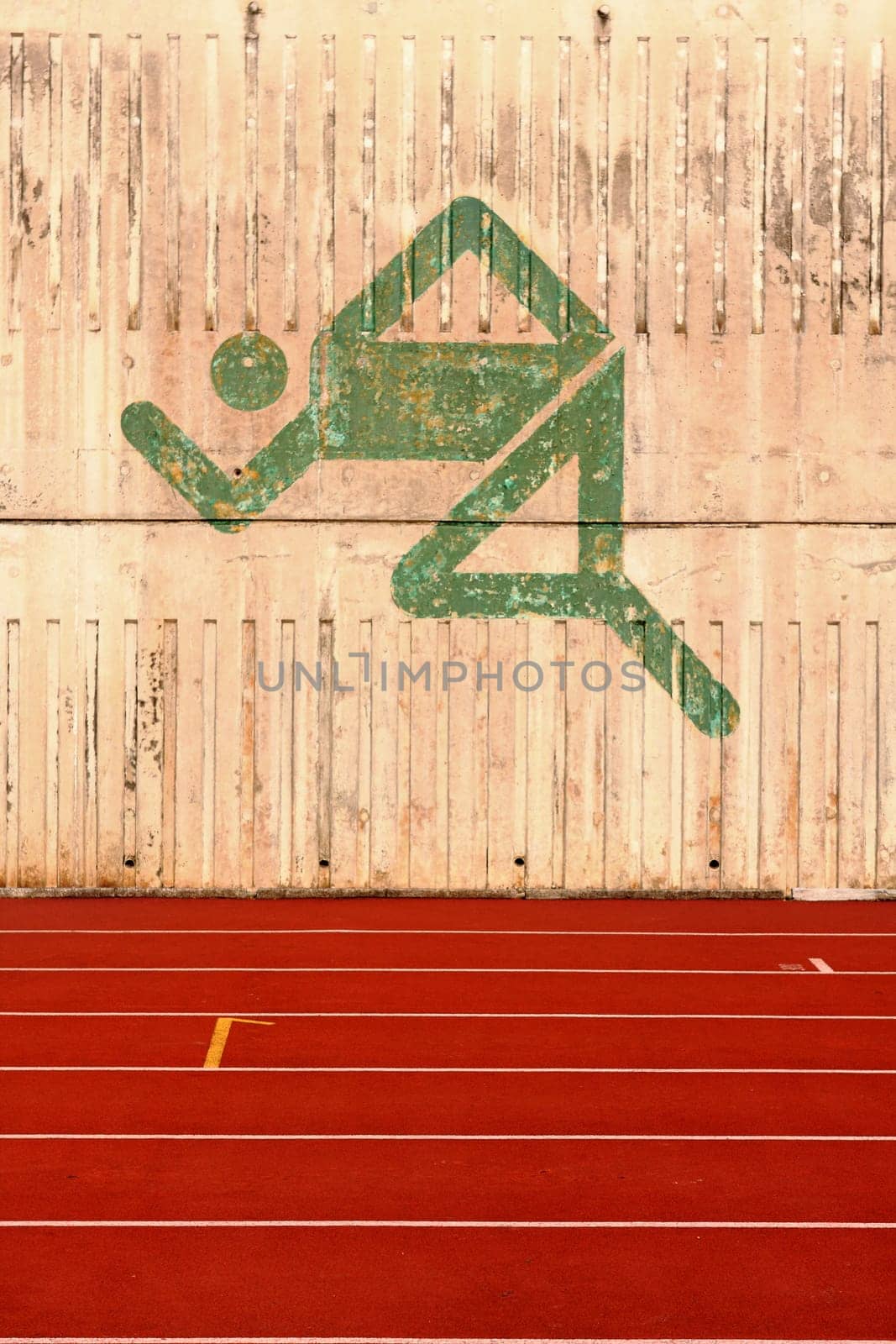 running track and a logo on the wall.