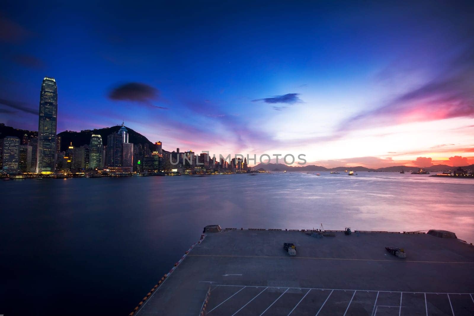 Hong Kong cityscape in sunset and dock