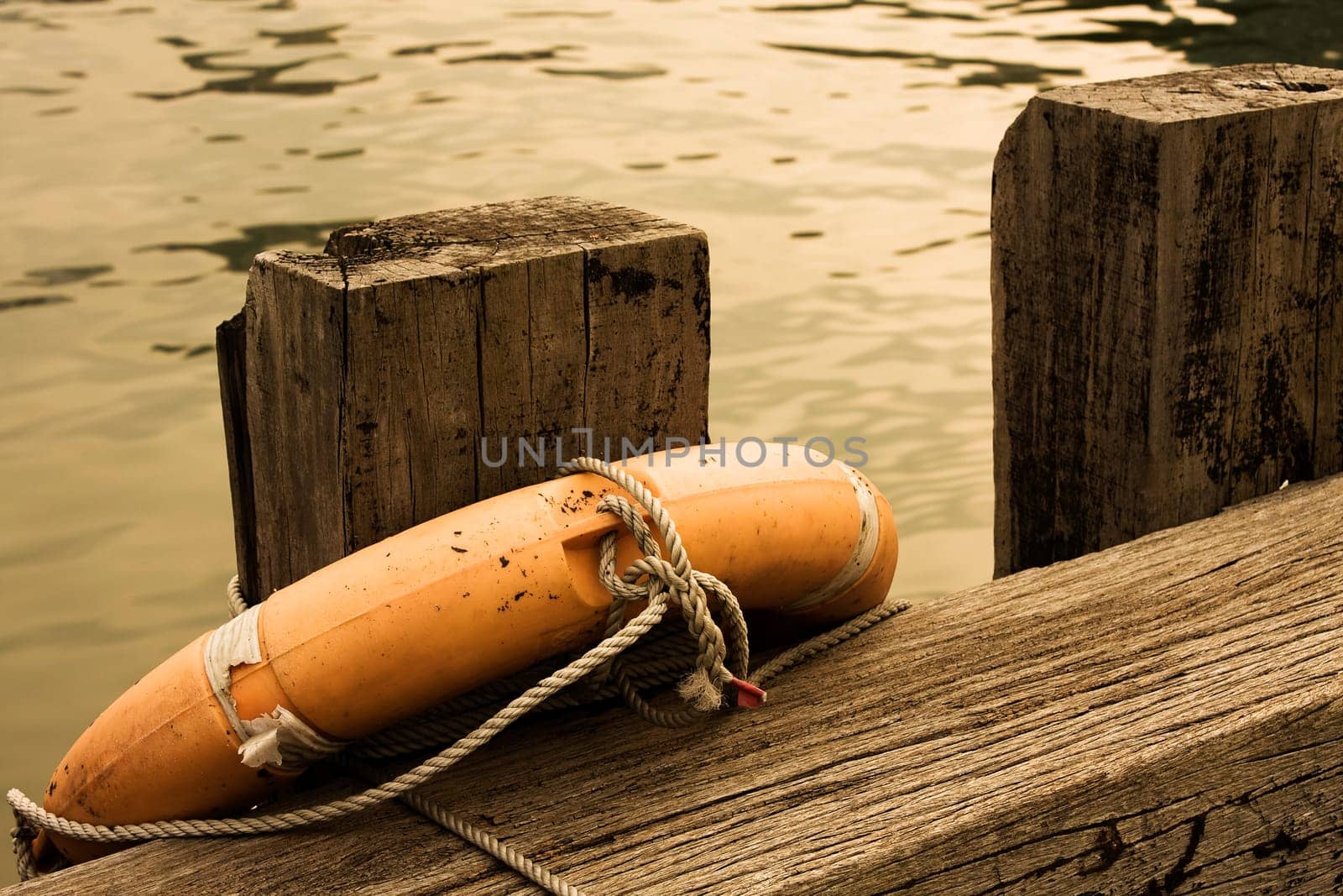 Lifebuoy on a wood in a dock ,close up