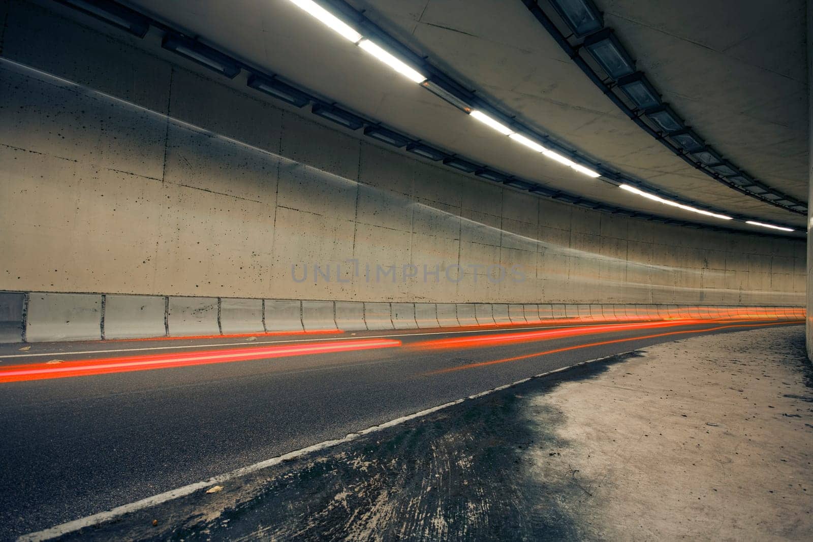 Car lights trails in a old tunnel