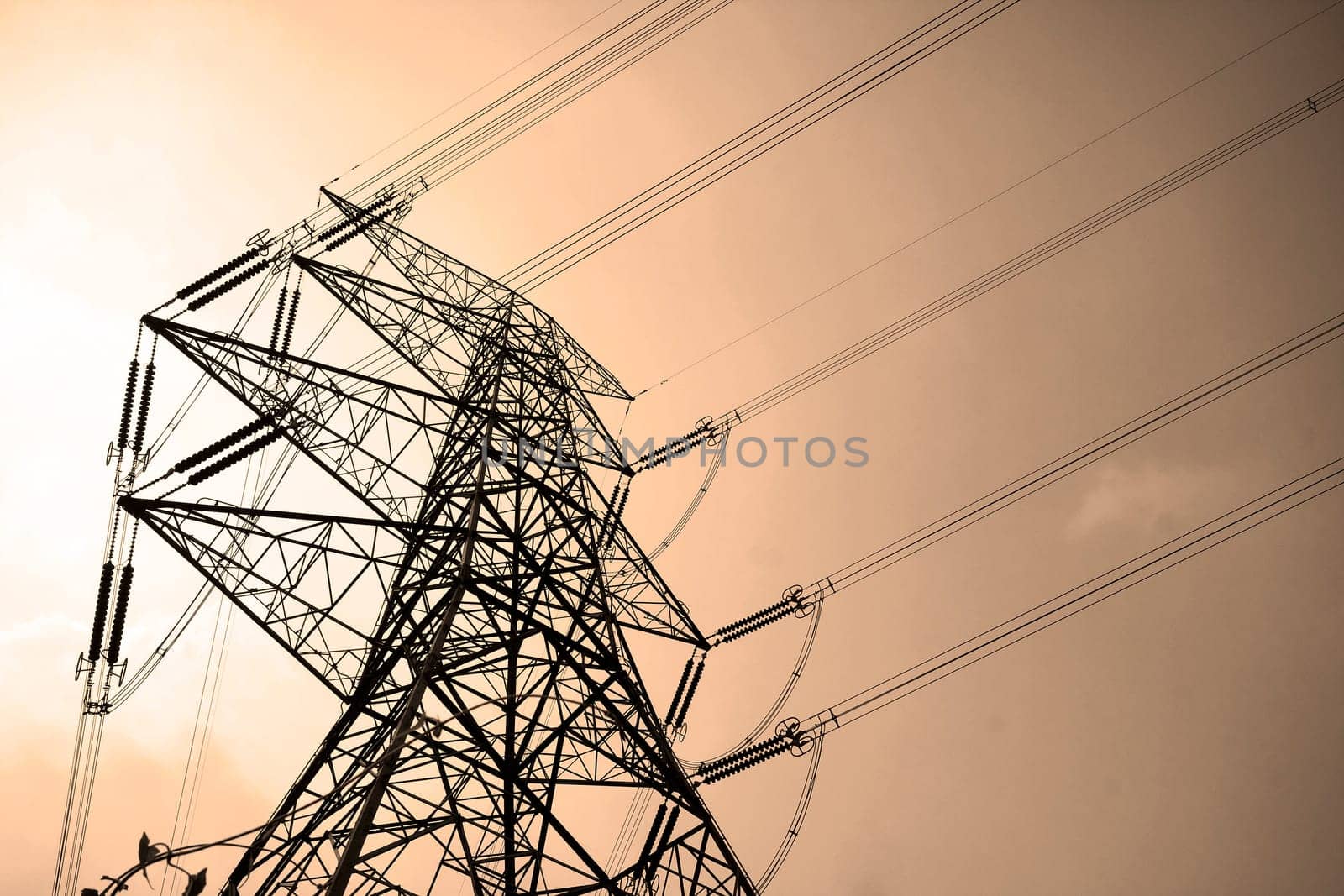 Electricity pylons with long cable at day