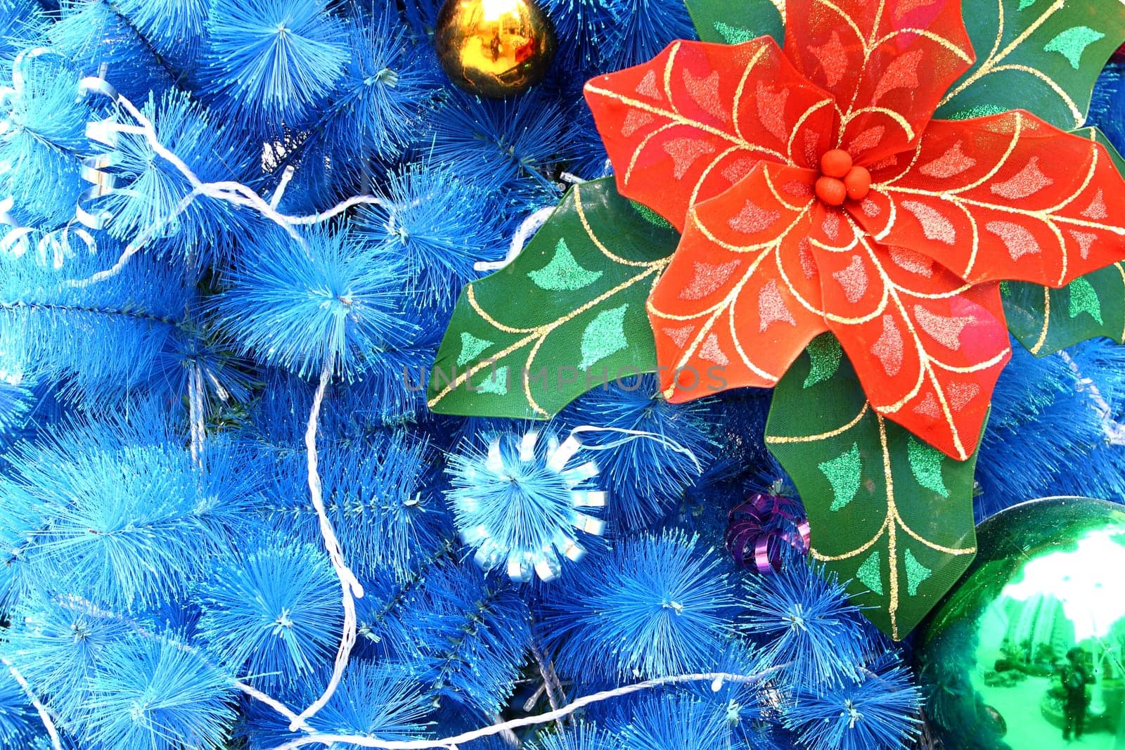 blue christmas background with balls and flower