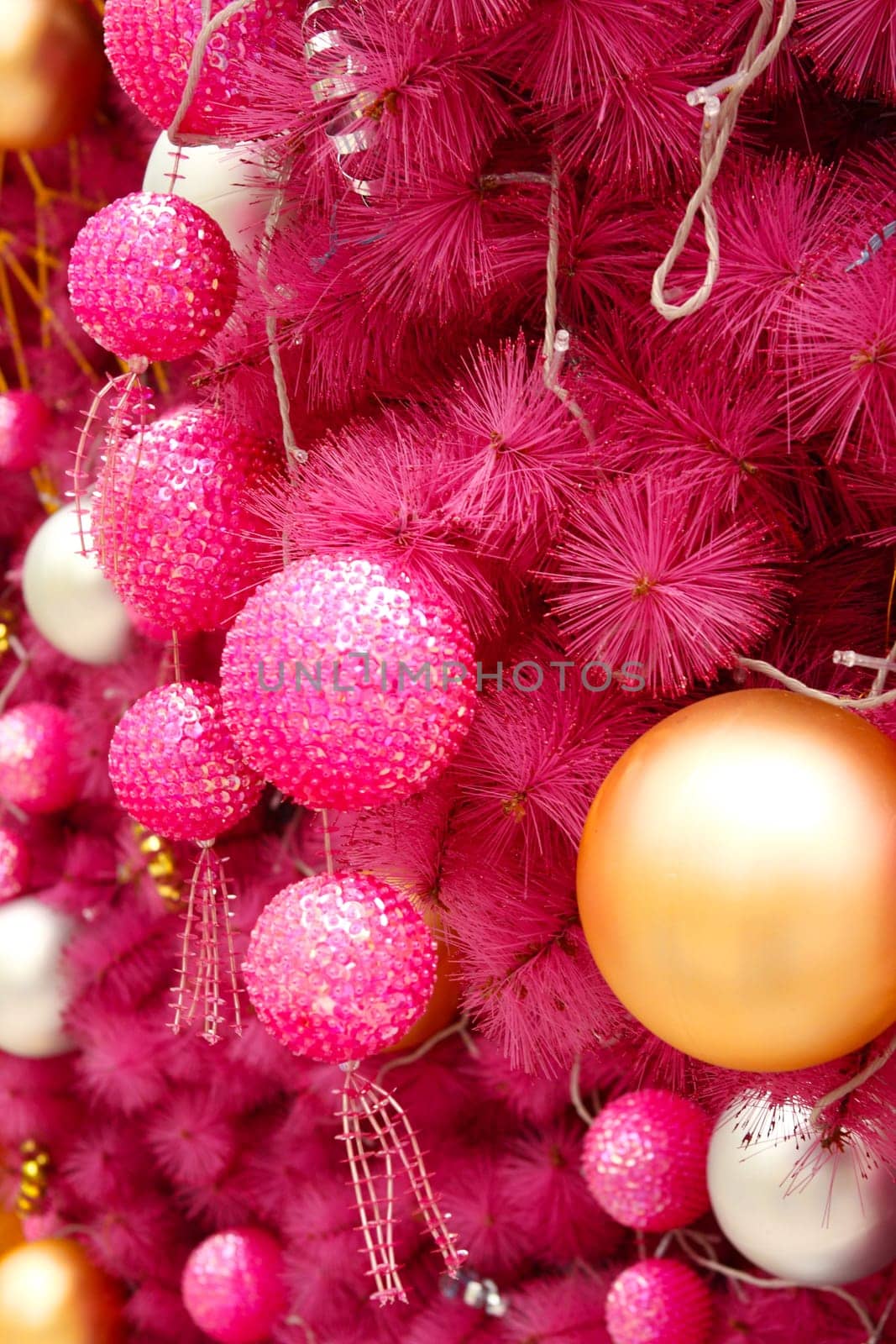pink christmas background with many balls