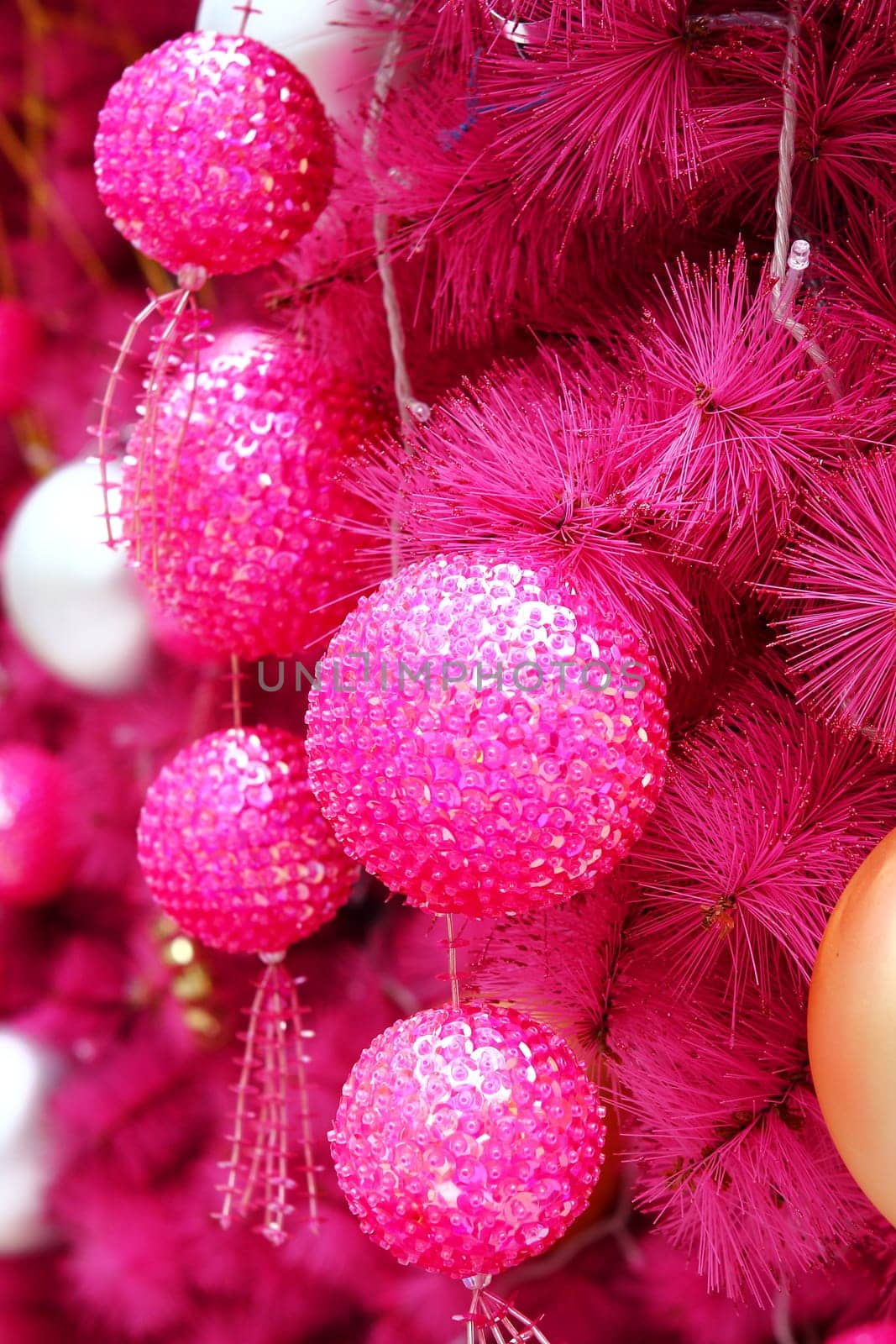 pink christmas background with many balls