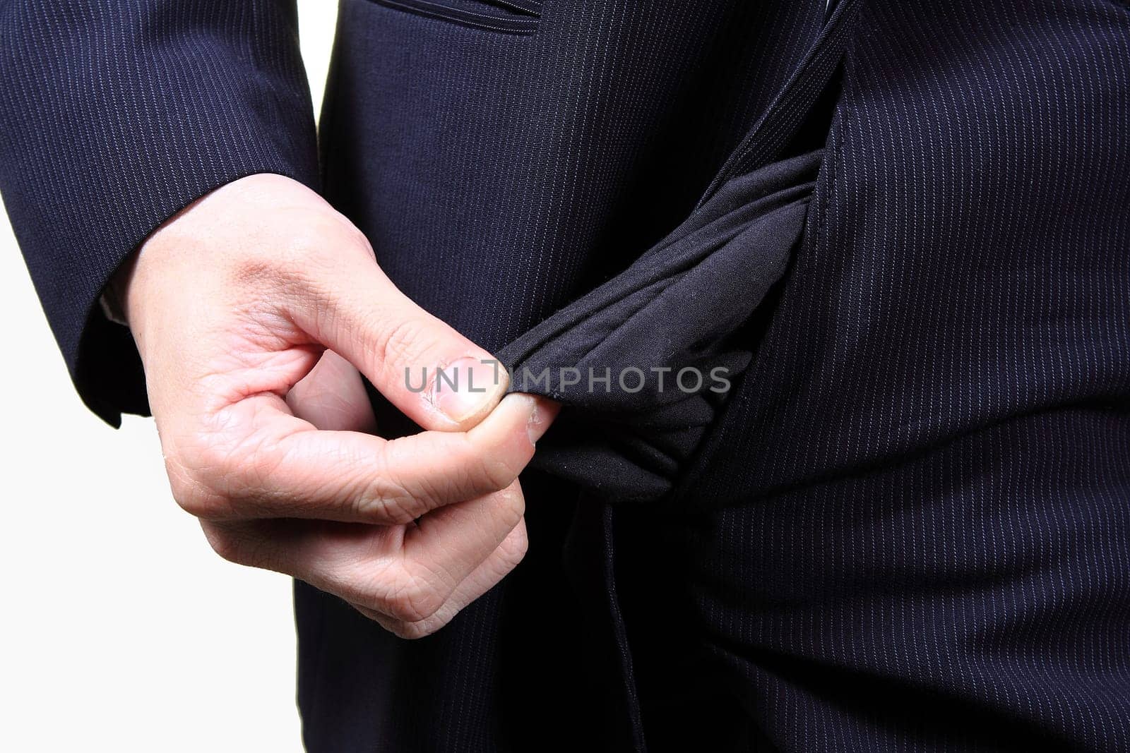 young male shows empty pockets in his trousers, business concept, studio shoot isolated on white background