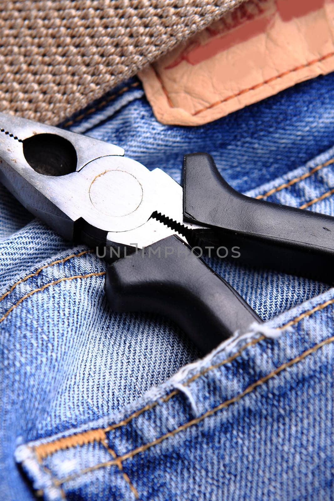 pliers in the jeans' pocket