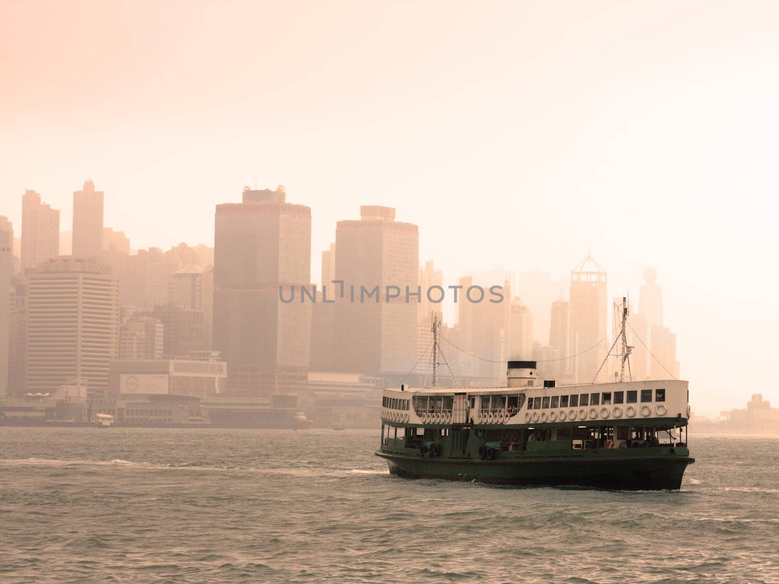 Famous landmark of Hong Kong ferry sailing on Victoria Harbor, Asia.