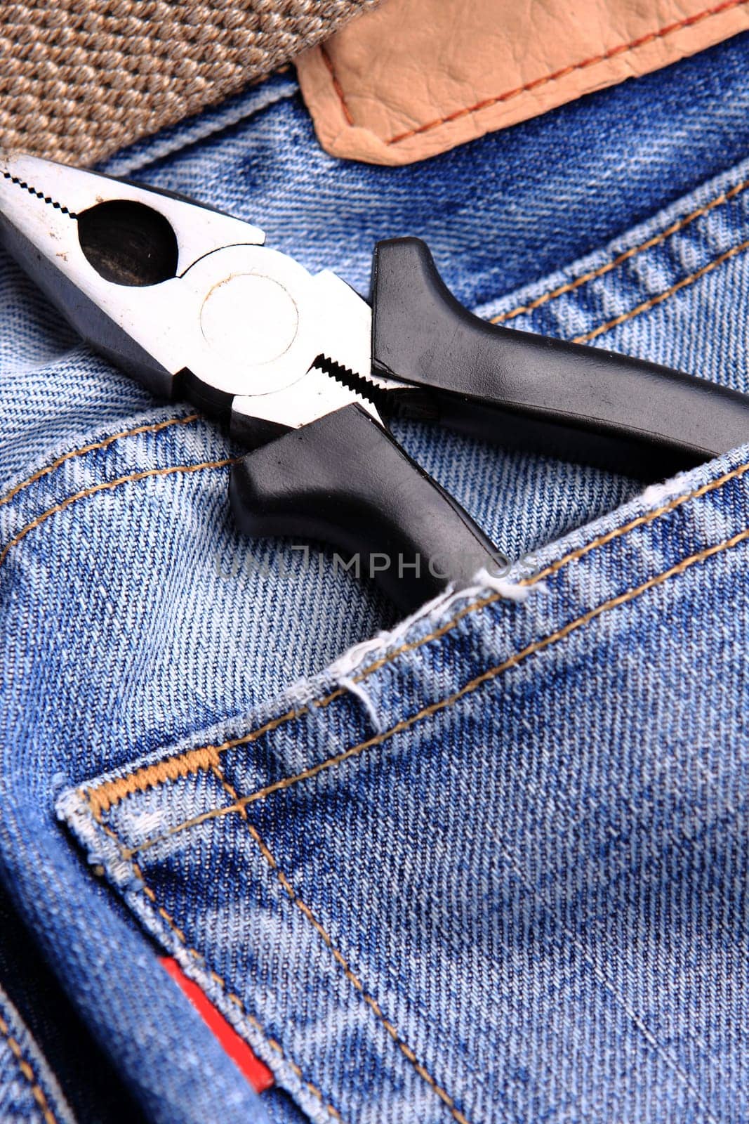 pliers in the jeans' pocket