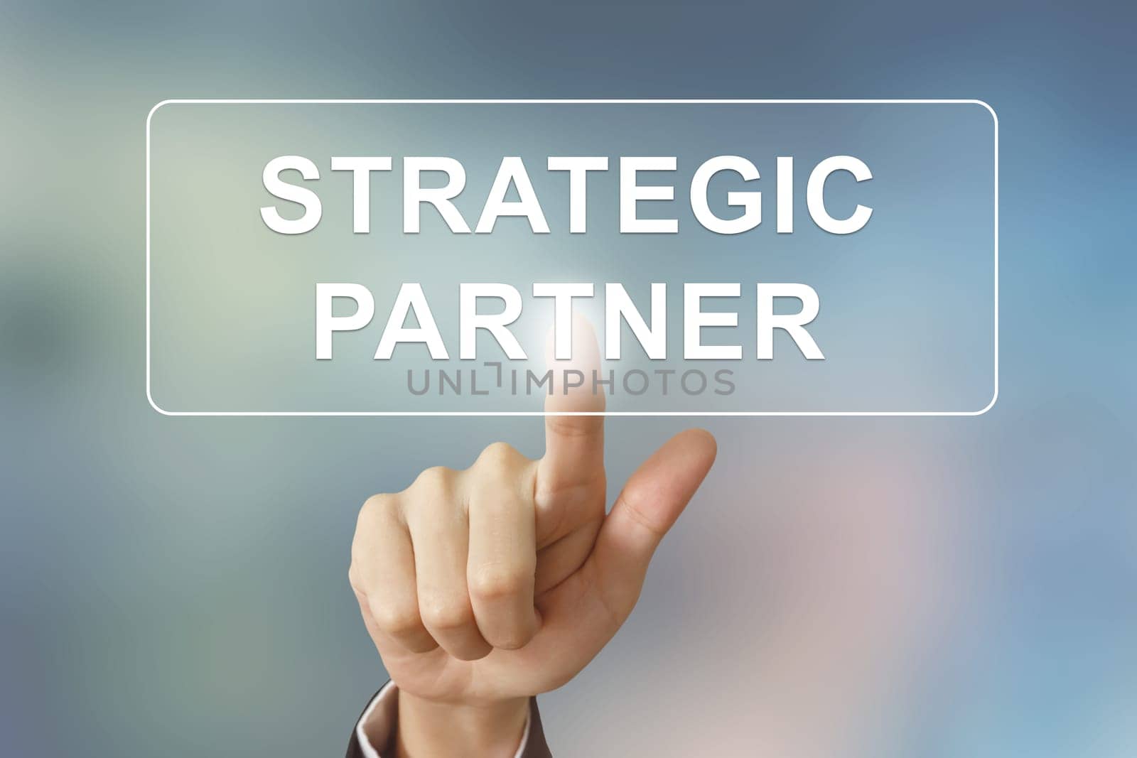 business hand pushing strategic partner button on blurred background