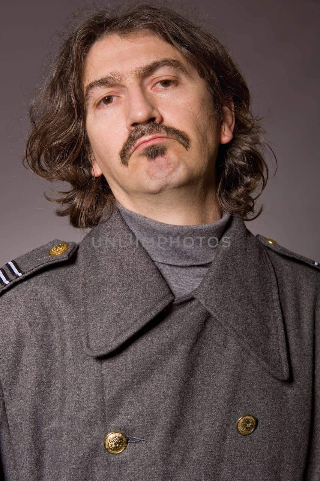young man dressed as russian military, studio picture