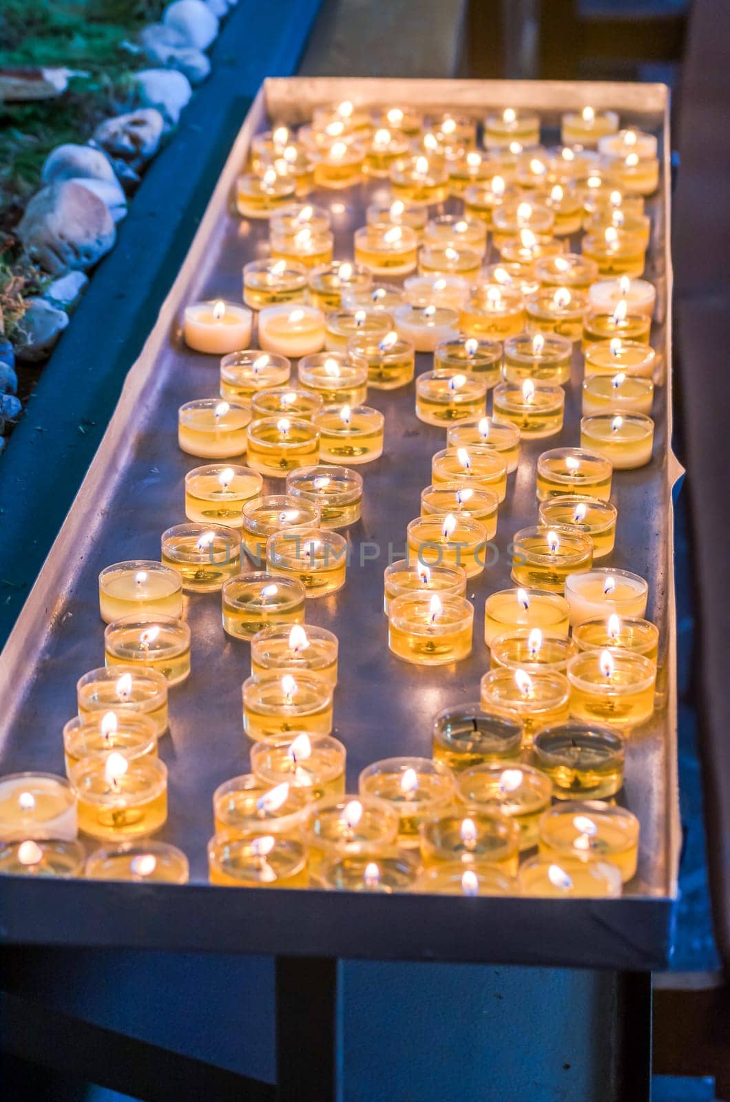 Burning candles,tea lights in a church.