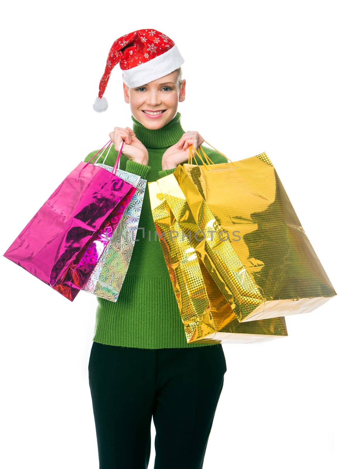 blonde smiling woman with christmas hat holding gift bags