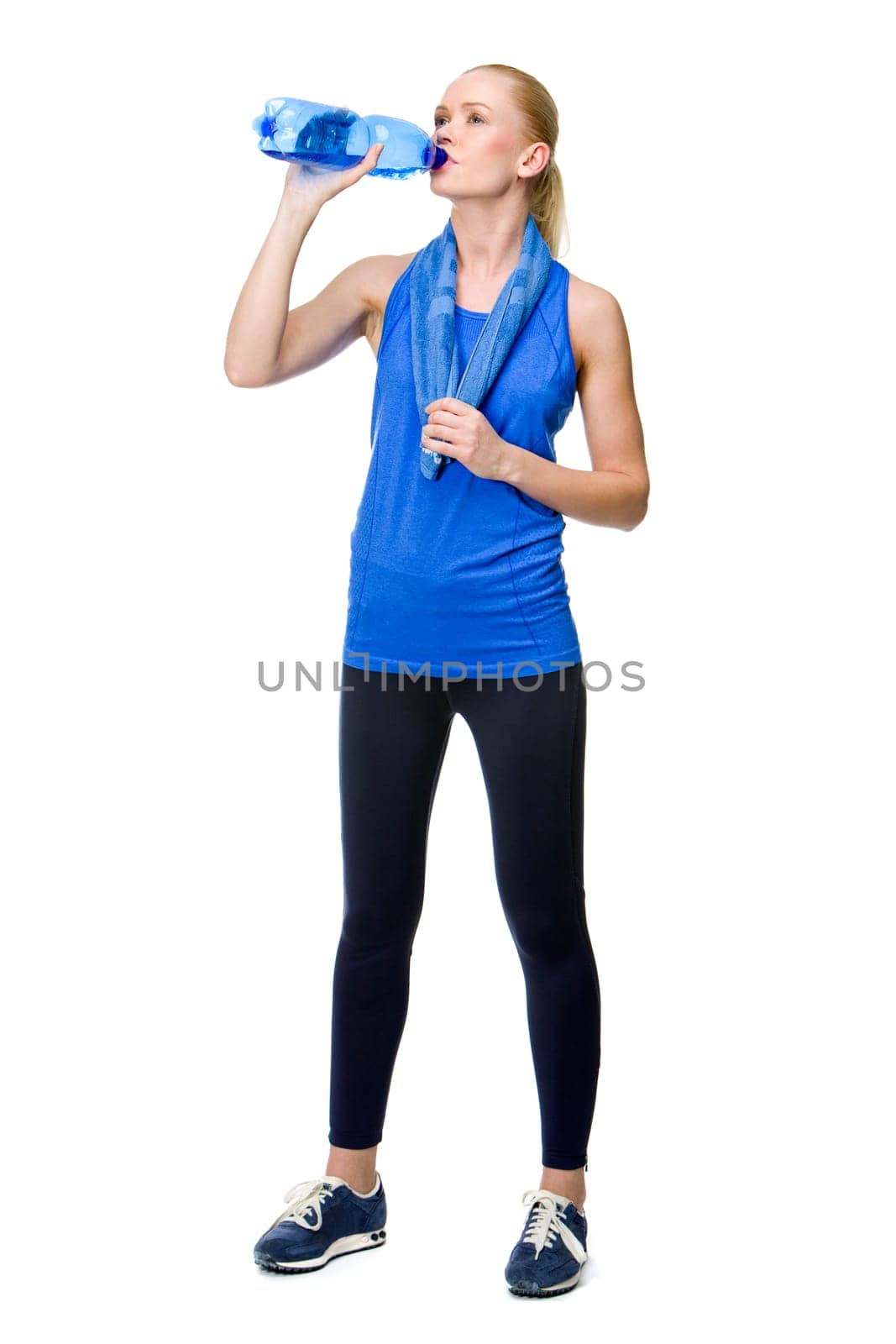 blonde woman wearing fitness clothing and drinking water