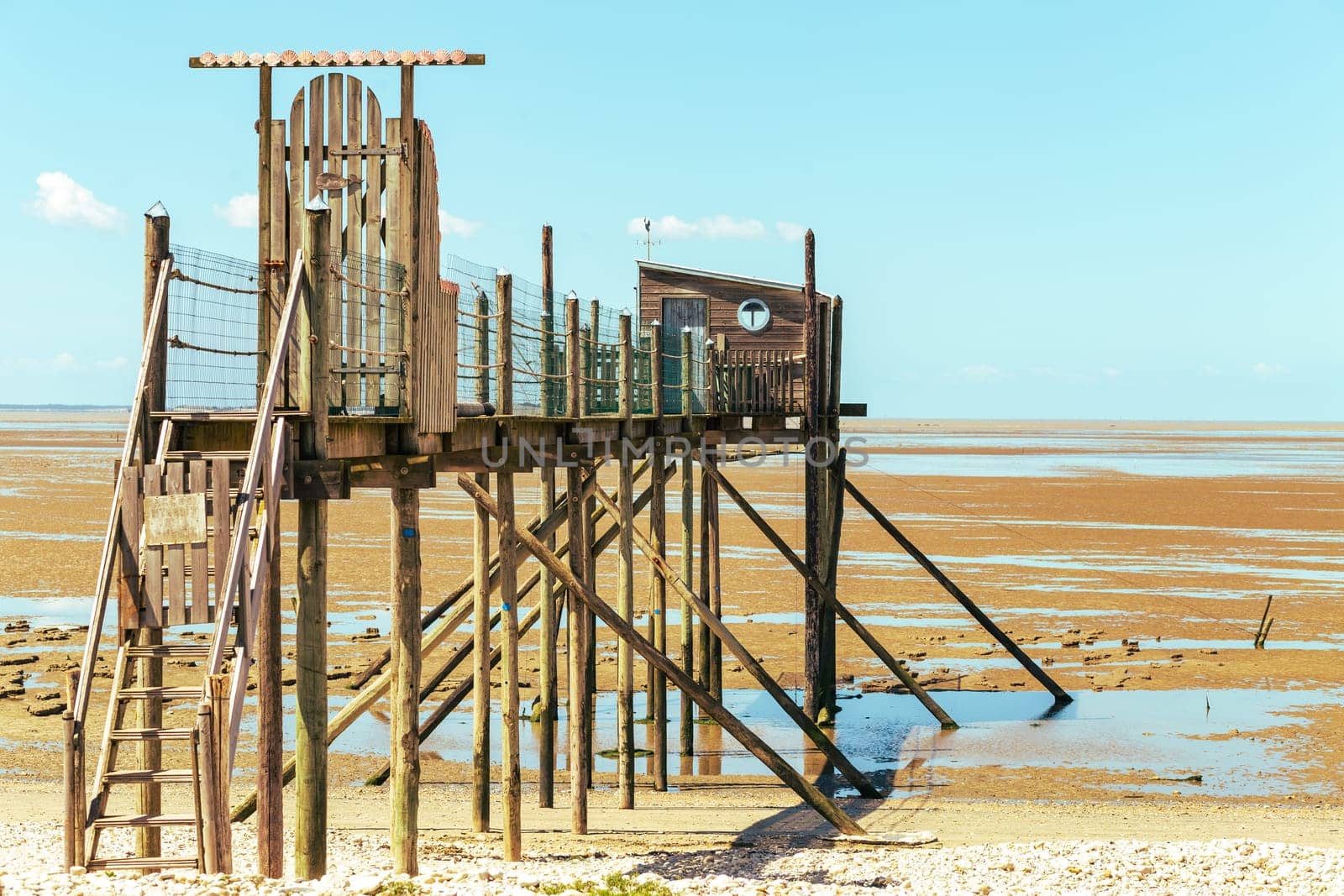 Hut of the fisherman resting on piles in Yves bay, France