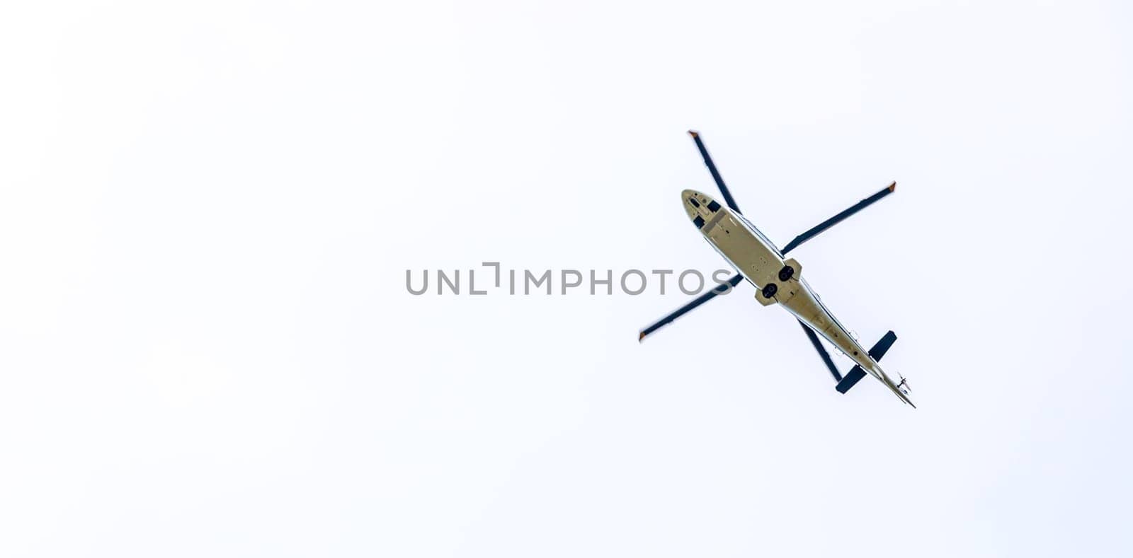 Helicopter in the sky, white clouds