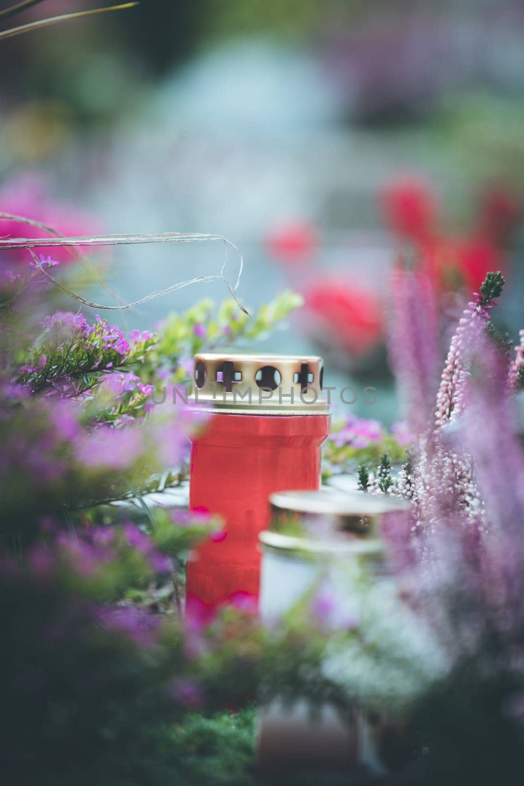 Candle on a grave at a cemetery