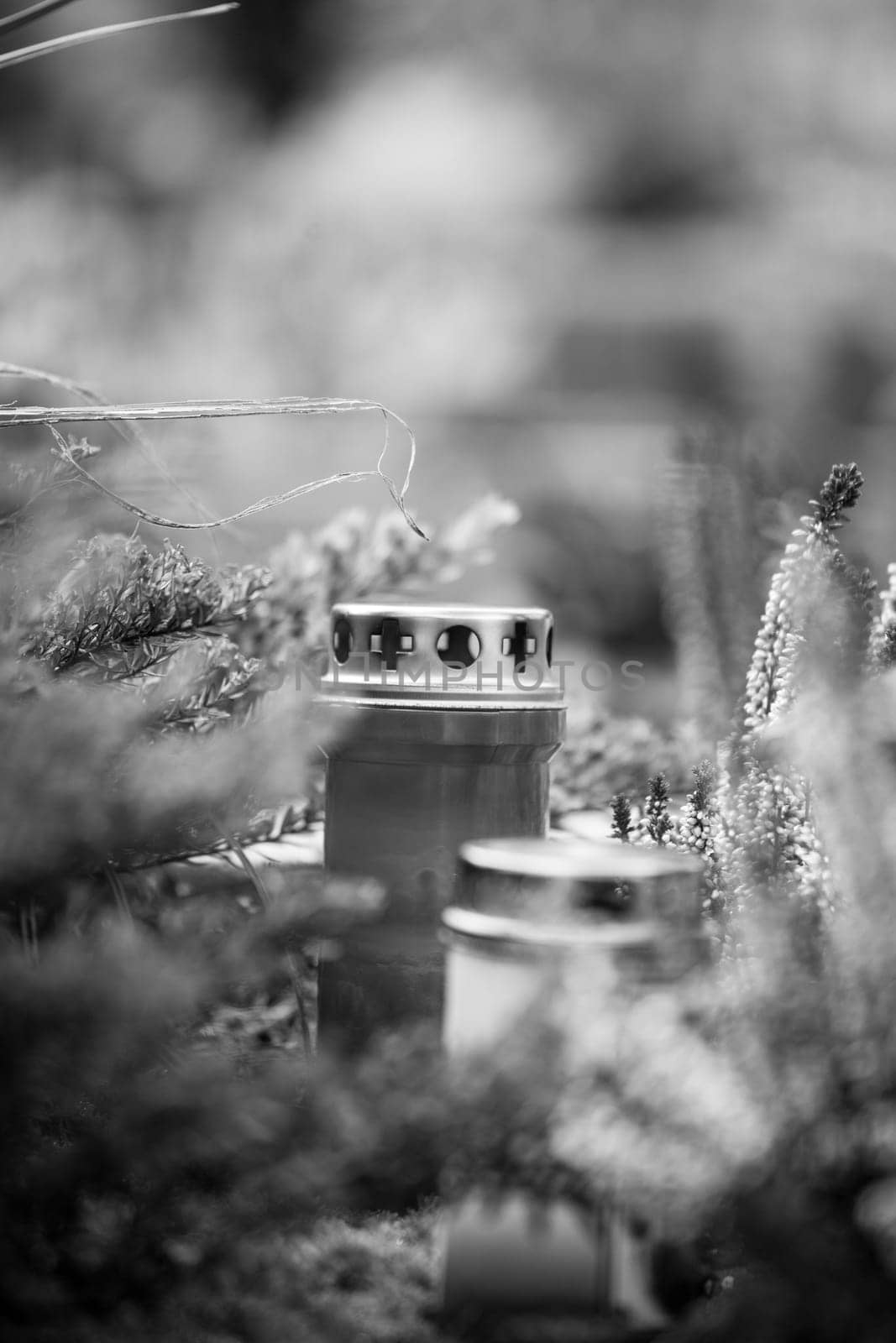 Candle on a grave at a cemetery