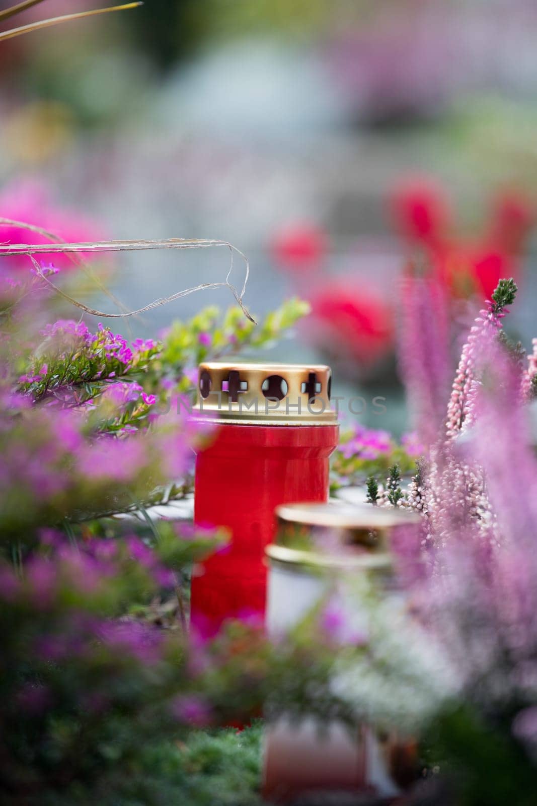Candle on a grave at a cemetery
