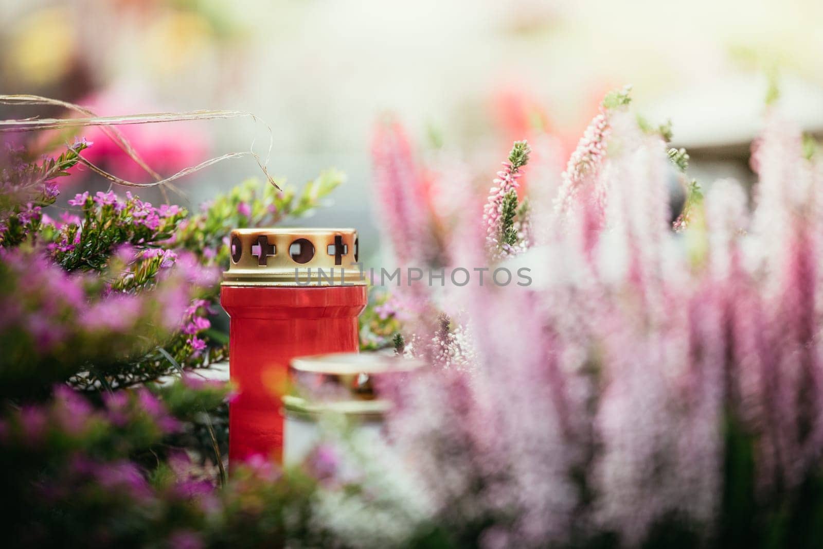 Candle on a grave at a cemetery