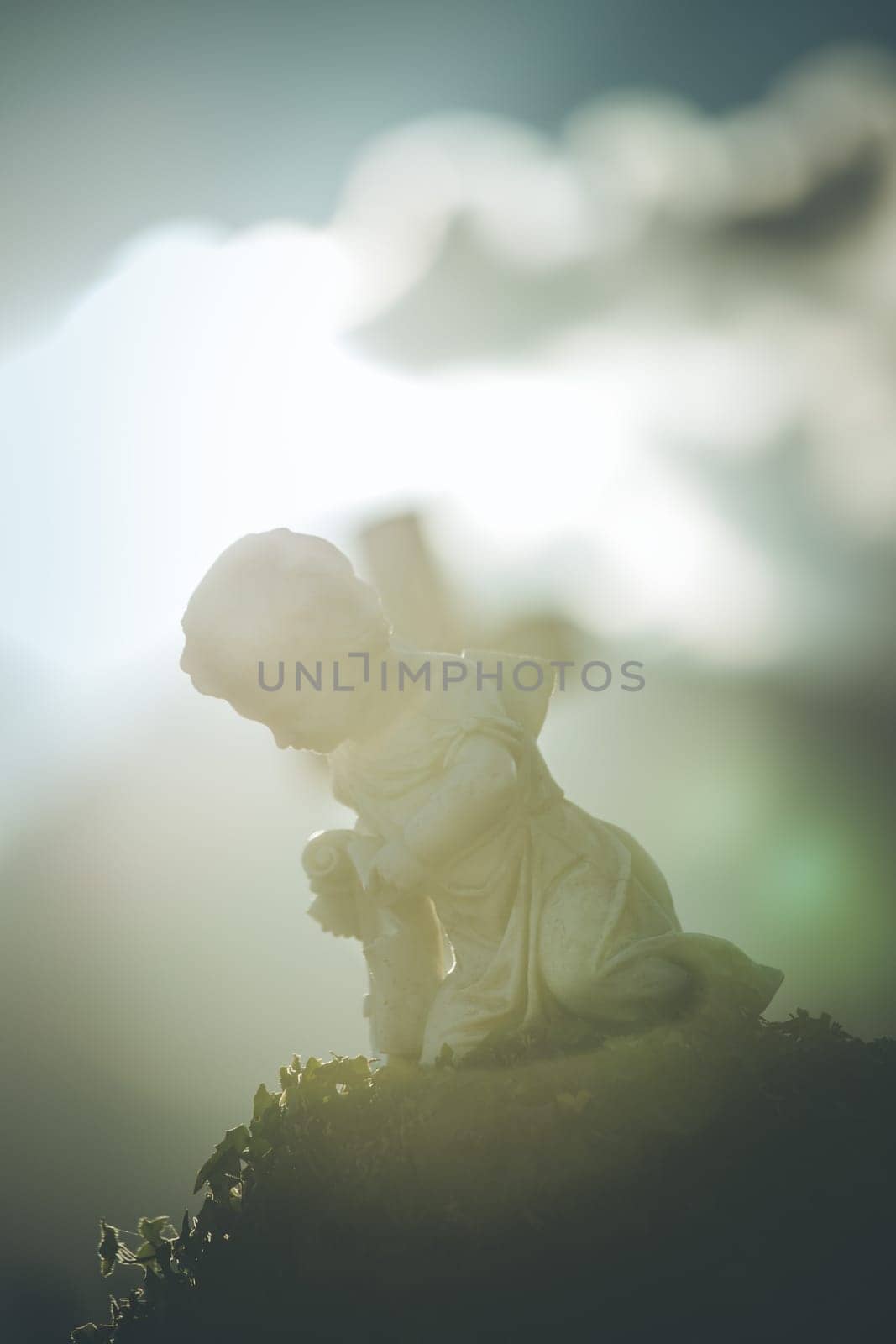 White angel on a grave at a cemetery