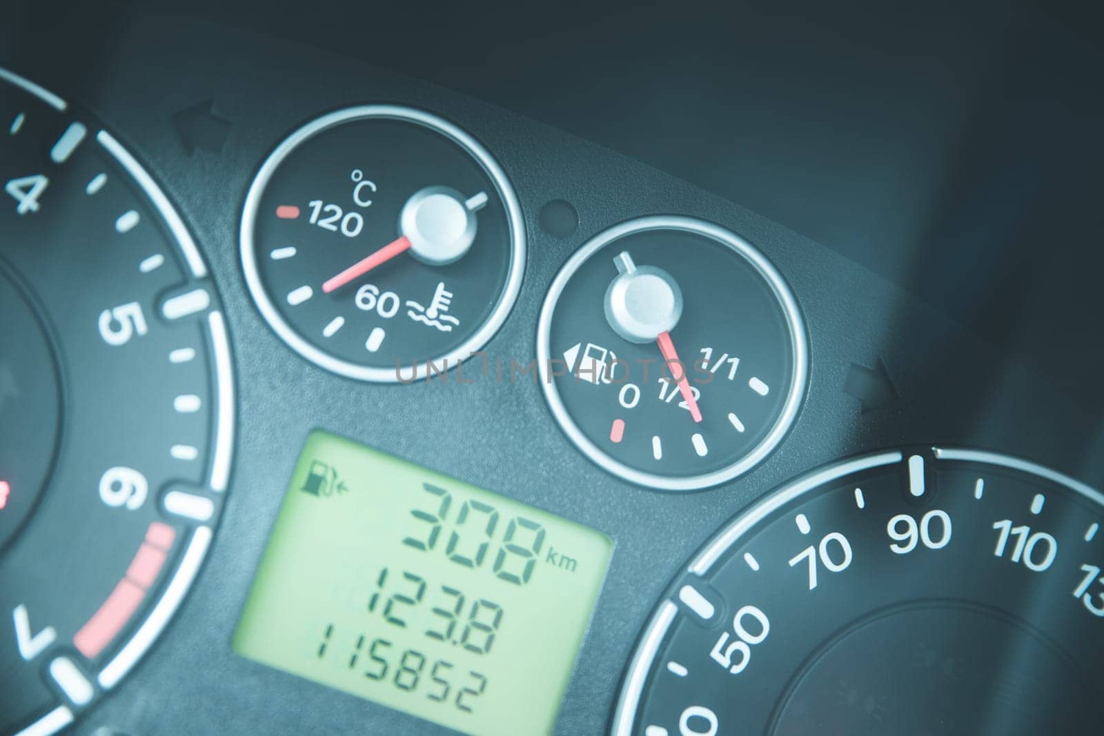 Close up picture of car dashboard with instruments and tachometer