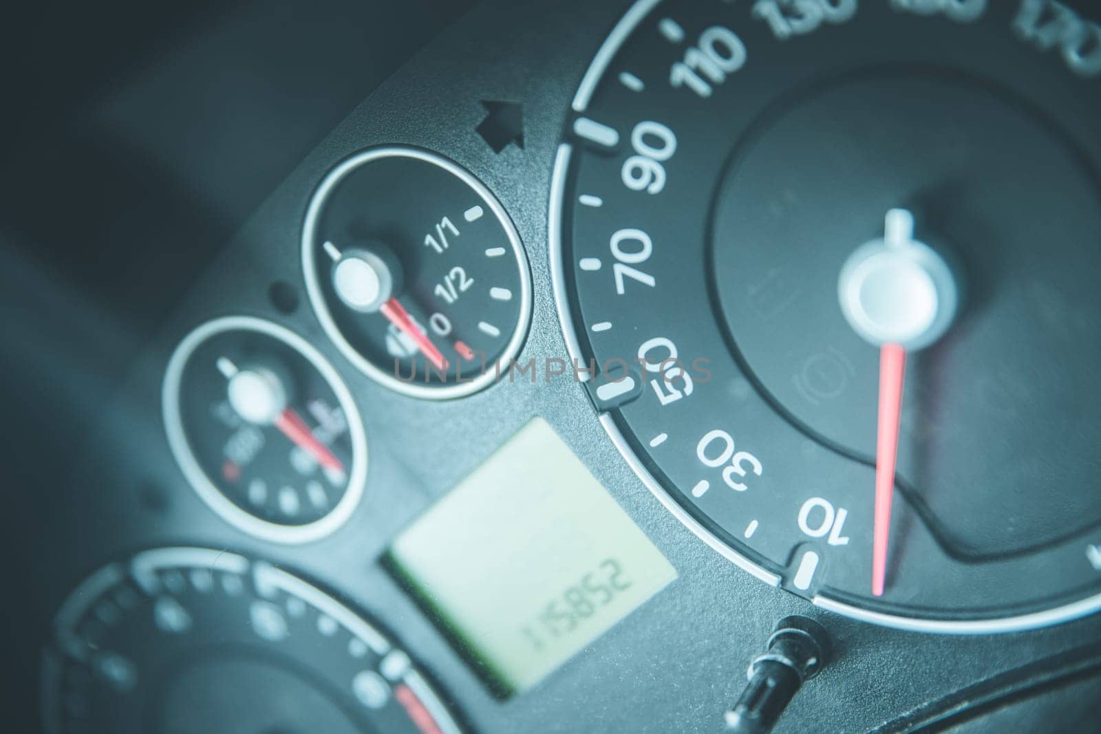 Close up picture of car dashboard with instruments and tachometer