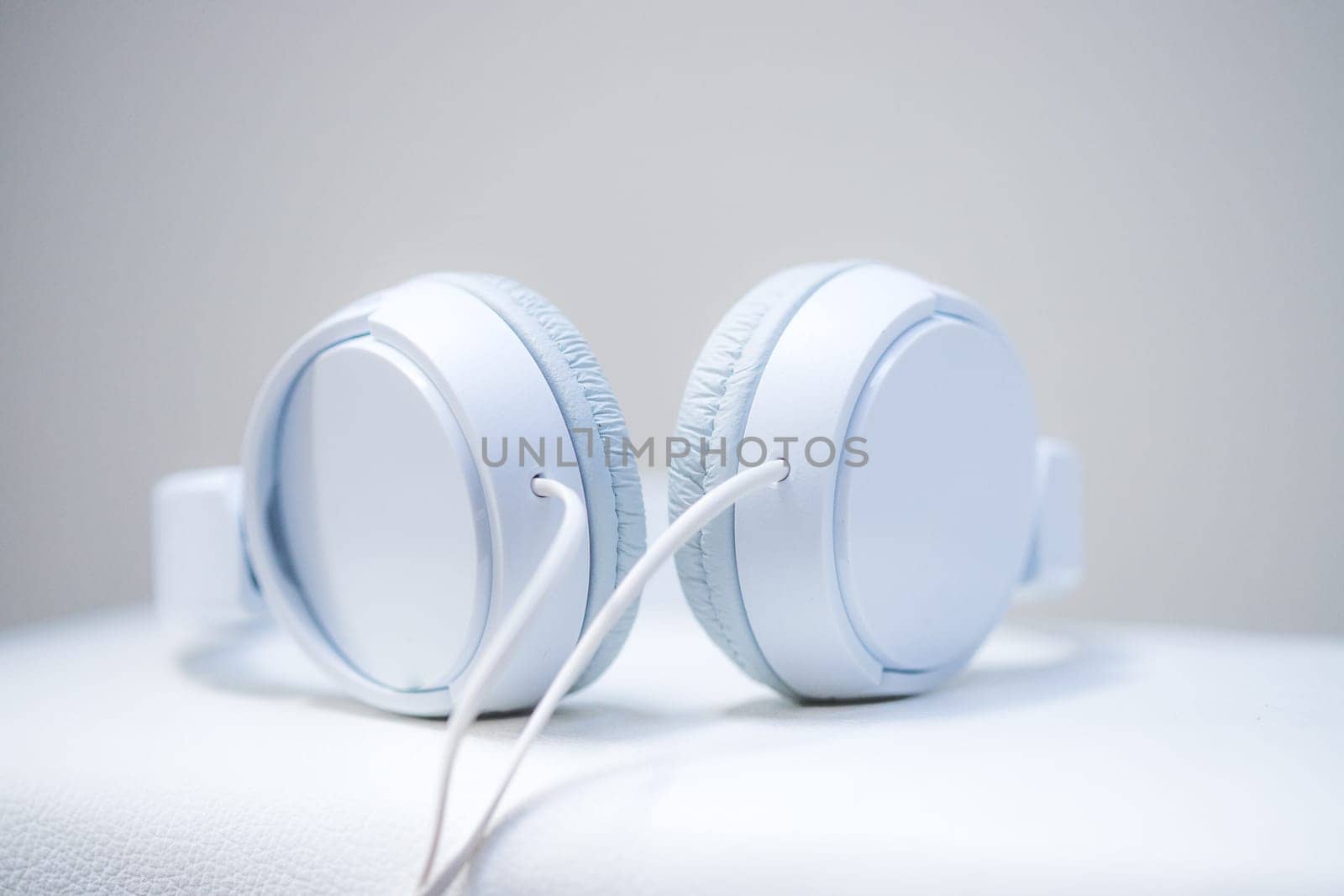 White designer headphones, music