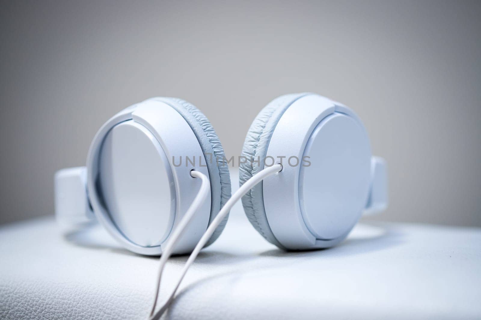 White designer headphones, music