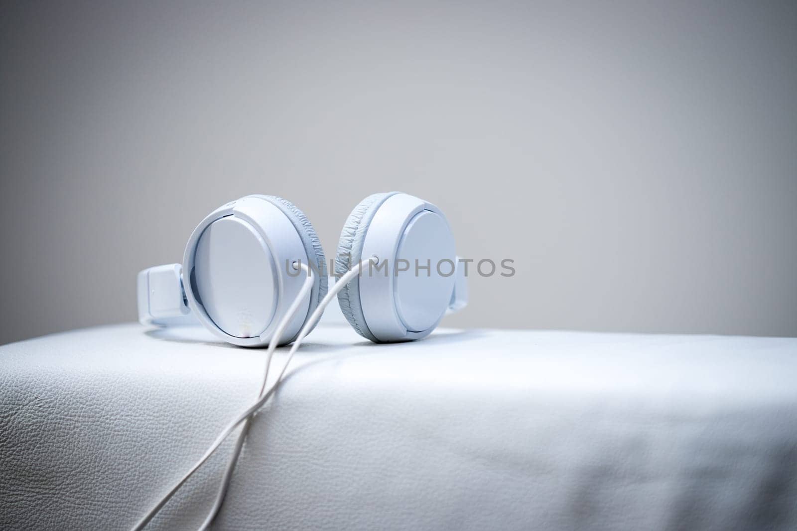 White designer headphones, music