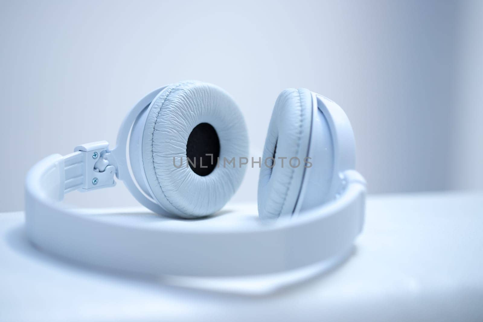 White designer headphones, music