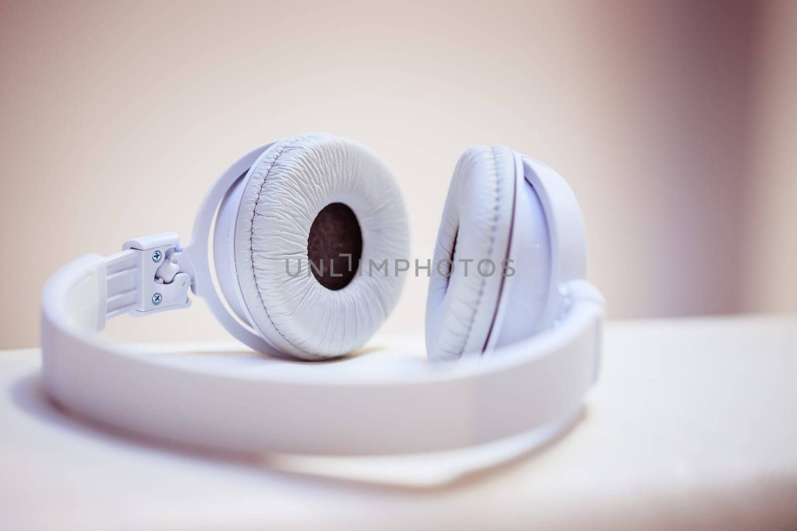 White designer headphones, music