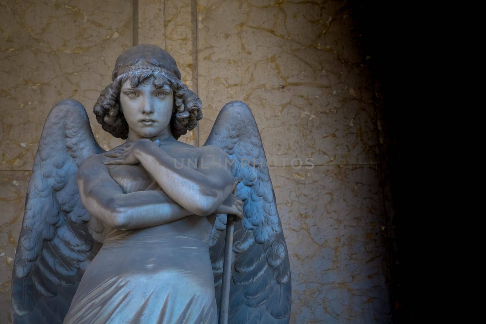 GENOA, ITALY - June 2020: antique statue of angel (beginning 1900, marble) in a Christian Catholic cemetery - Italy
