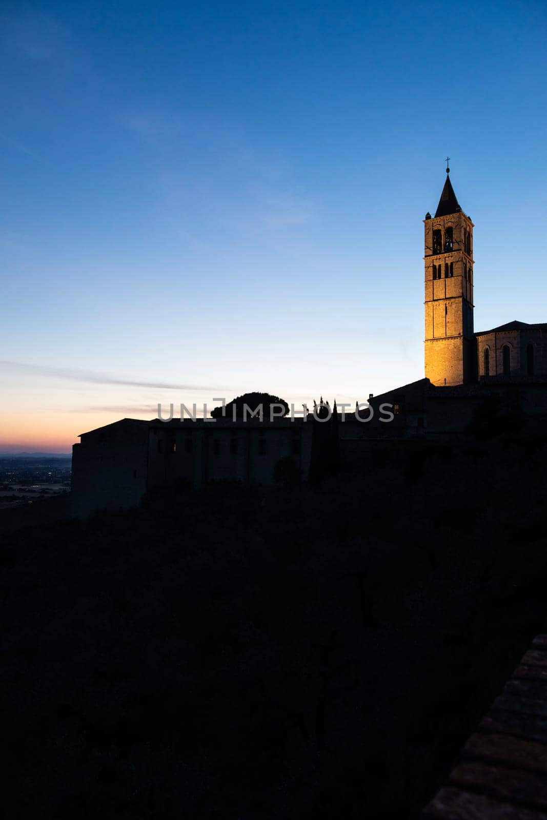 Church in Assisi village in Umbria region, Italy. The town is famous for the most important Italian St. Francis Basilica (Basilica di San Francesco)